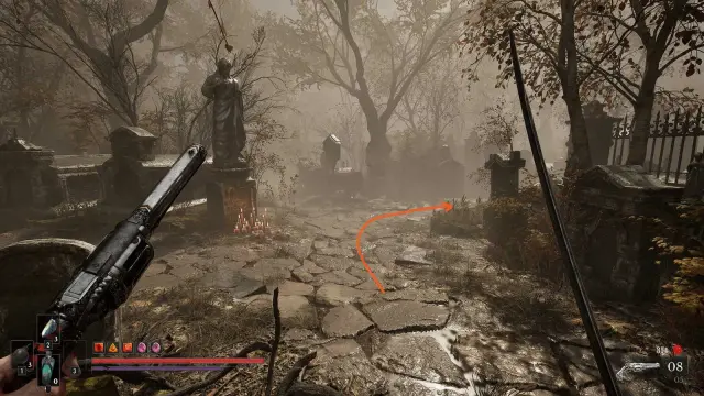 Fallen Village dirt path between bare trees and ruined buildings; clear regional context, with a small red route arrow.
